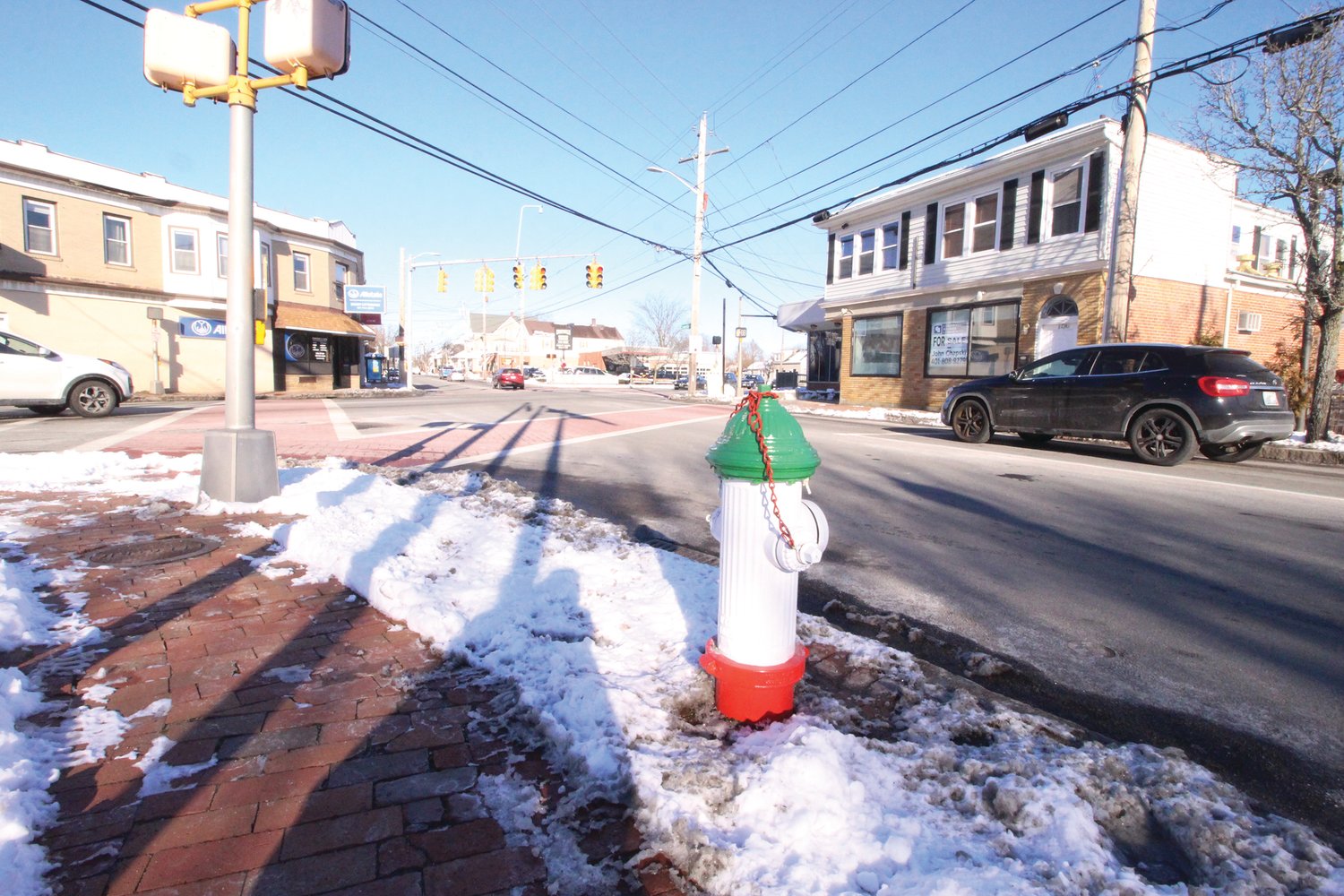 ITALIAN PRIDE: Painted in the colors of the Italian flag, fire hydrants in Knightsville display the strong Italian heritage and roots of locals. Holiday lights in the area also capture these colors – not to mention the road with its green, white and red stripes separating the traffic.